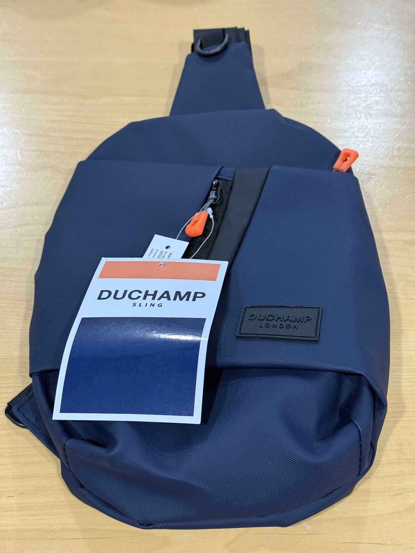 DUCHAMP London Sling Bag Backpack Crossbody Bag Blue Nylon Lightweight. MSRP 55$ New with Tags.