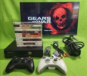 Microsoft Xbox 360 slim with 2 controllers 12 games HDMI cord power supply