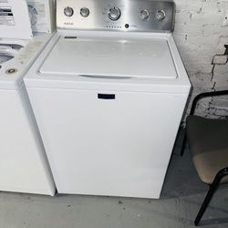 Maytag white washing machine, includes a receipt with a 60-day warranty.