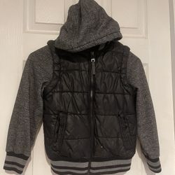 Size 7 black vest with built in hoodie by Urban Republic 