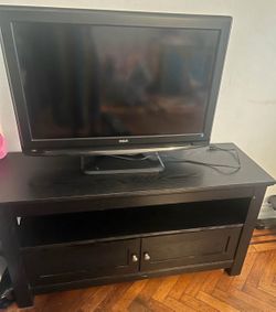 TV with TV stand or small table with drawers