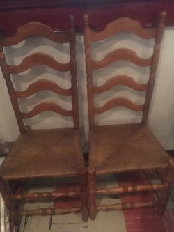 2 ladder back woven seat chairs.