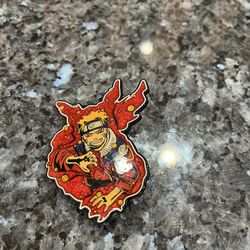Naruto glitter enamel pin of the anime character Naruto Uzumaki.  Size appropriately 2 1/2 inches long and 2 1/4 inches wide.  Brand Blast bolt.  Preo