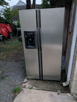 Black and stainless steel front side by side refrigerator