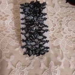 handcrafted gray wide woven bracelet