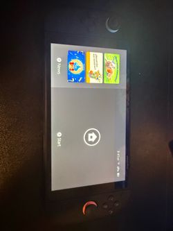 Nintendo Switch 2 with extra controller and one game.