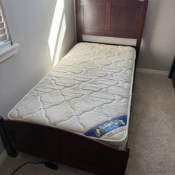 Twin bed, wood frame with mattress
