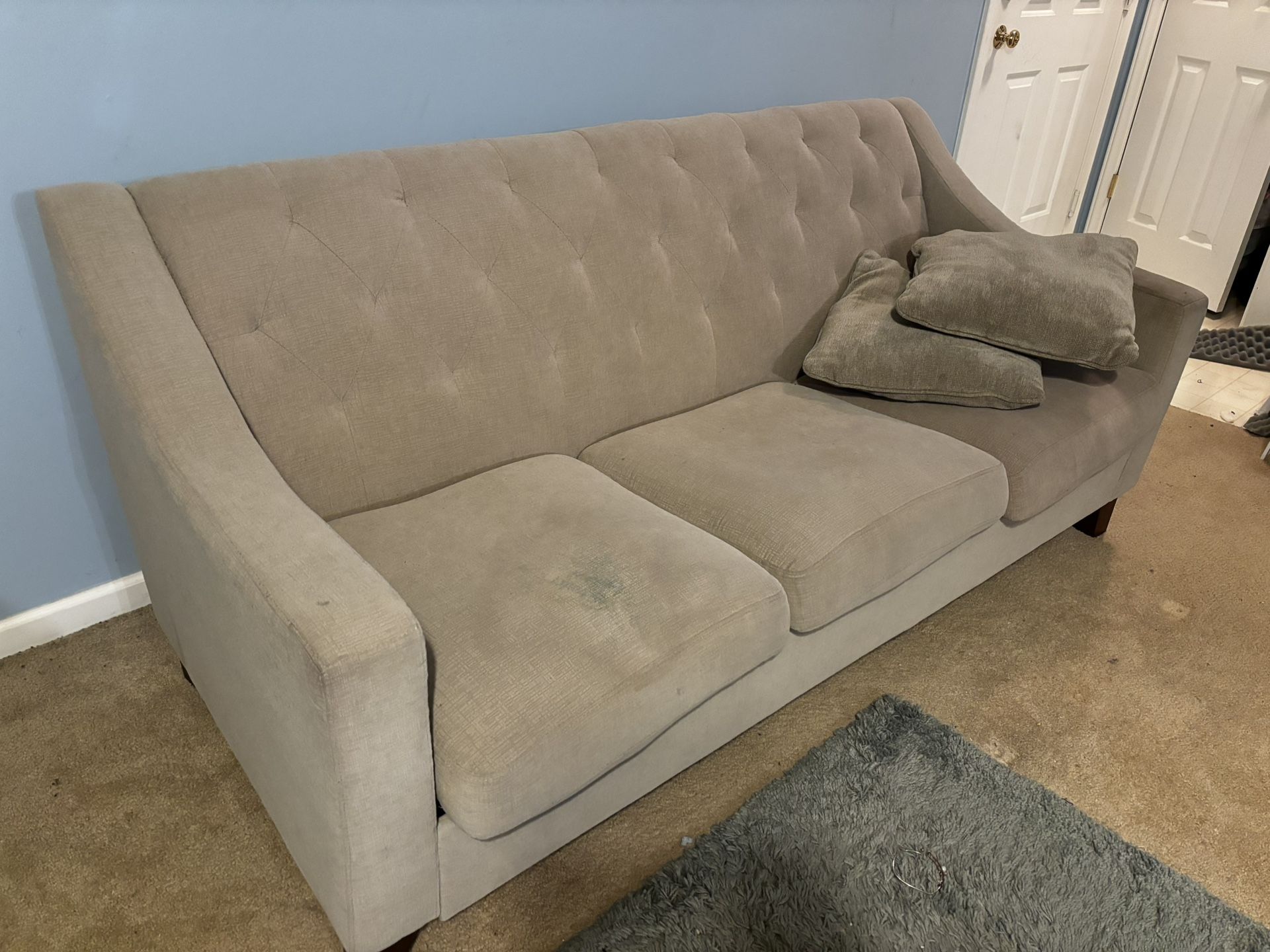 Cream tufted couch