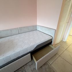 Twin size bed with twin size mattress.