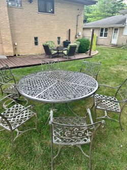 High end patio set, cost over $5000 new, 60” patio table with 6 chairs, 2 of them swivel, delivery available for extra cost