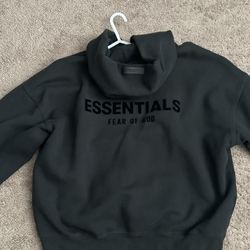 Small Black Fear of God Essentials hoodie