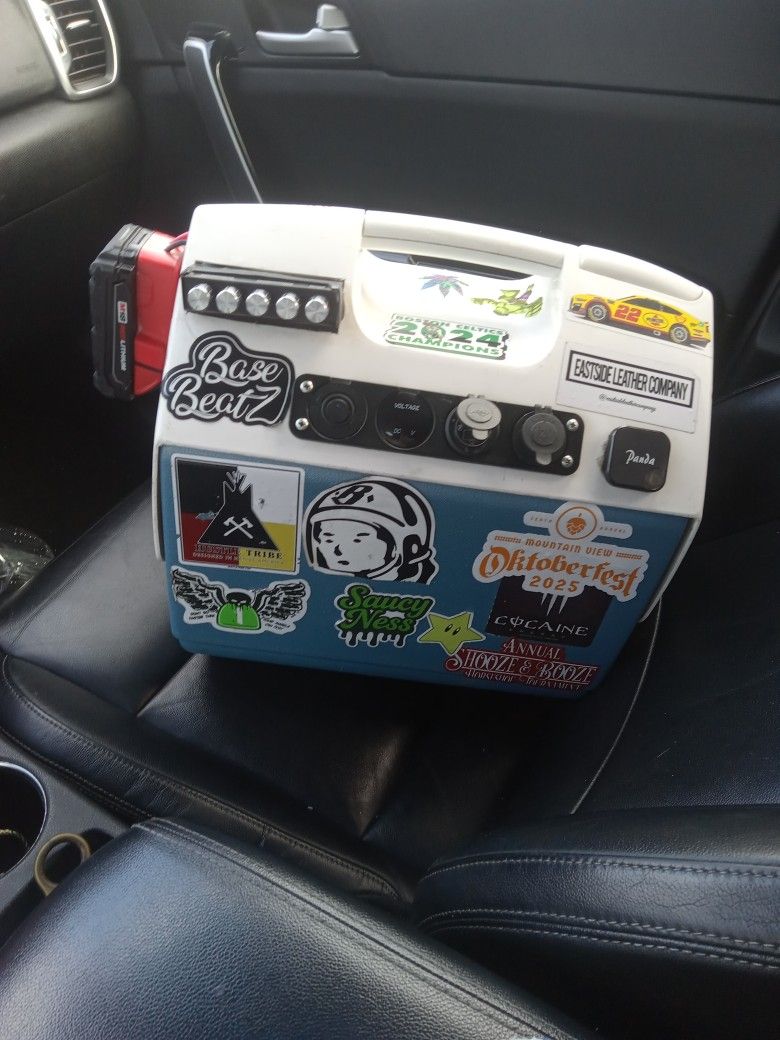 Cooler Base Beatz Everything Included What You See Bluetooth compatible And a magnet hold their hold , Your phone. And a u s b court and a twelve V