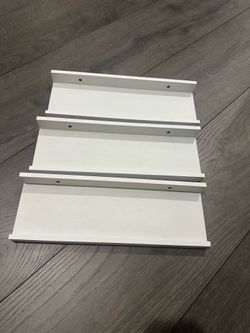 3 white shelves