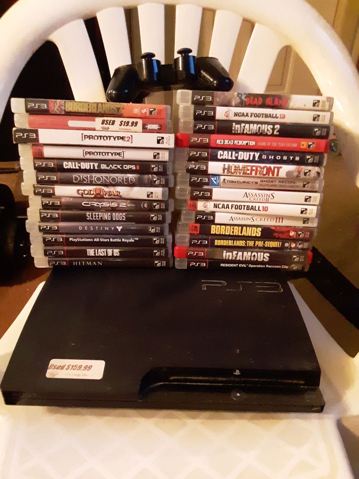 PS3 w/27 games & 2 remotes