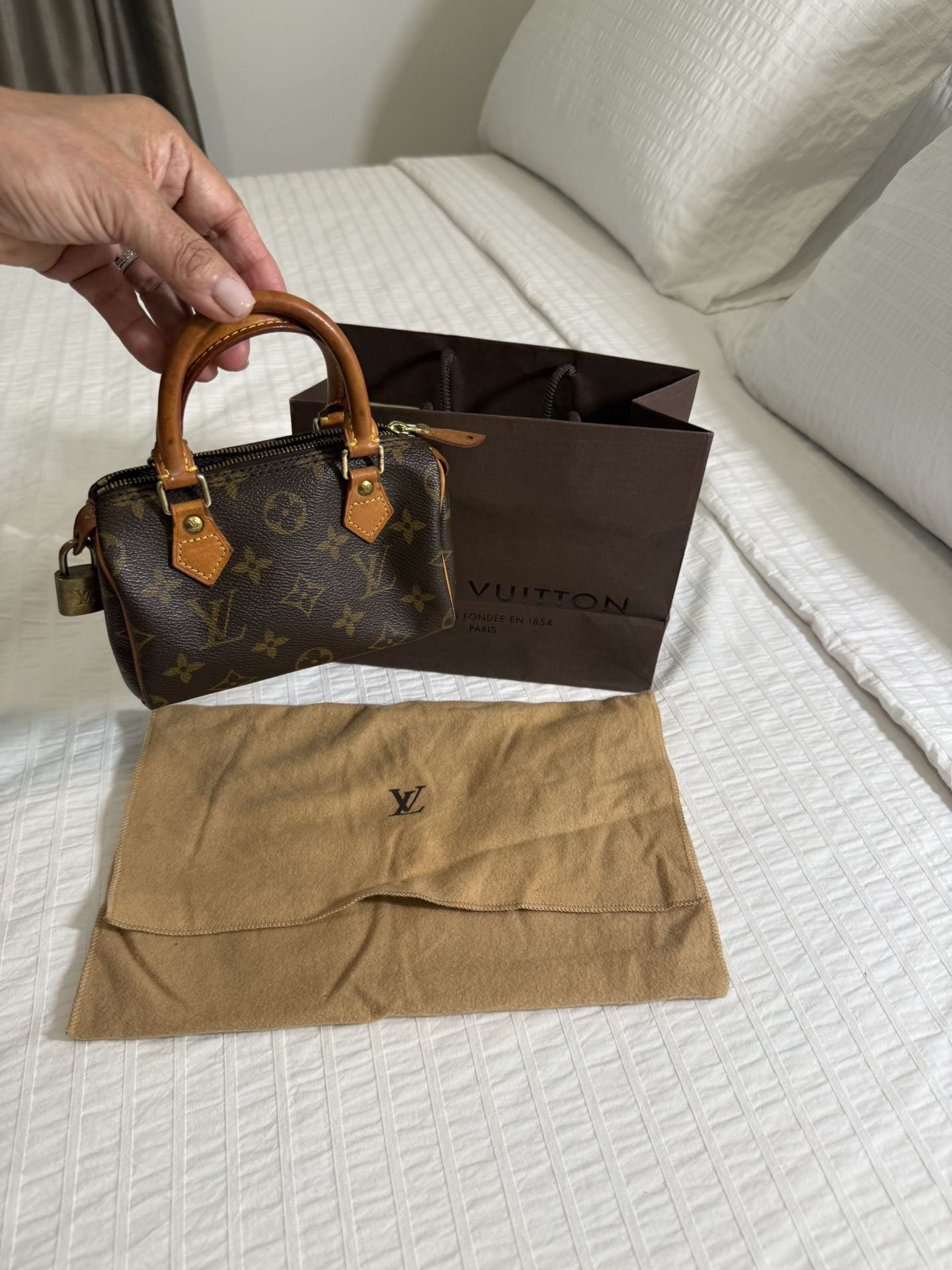 PRICE NEGOTIABLE. Bought in 2002 AUTHENTIC LOUIS VUITTON Monogram Mini Nano Speedy Hand Bag. Excellent condition, no flaws.