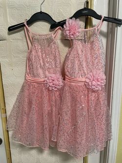 Matching pair of pink dance dresses
