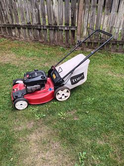 Toro self-propelled lawn mower with 6.75 motor has big wheels in the back runs great