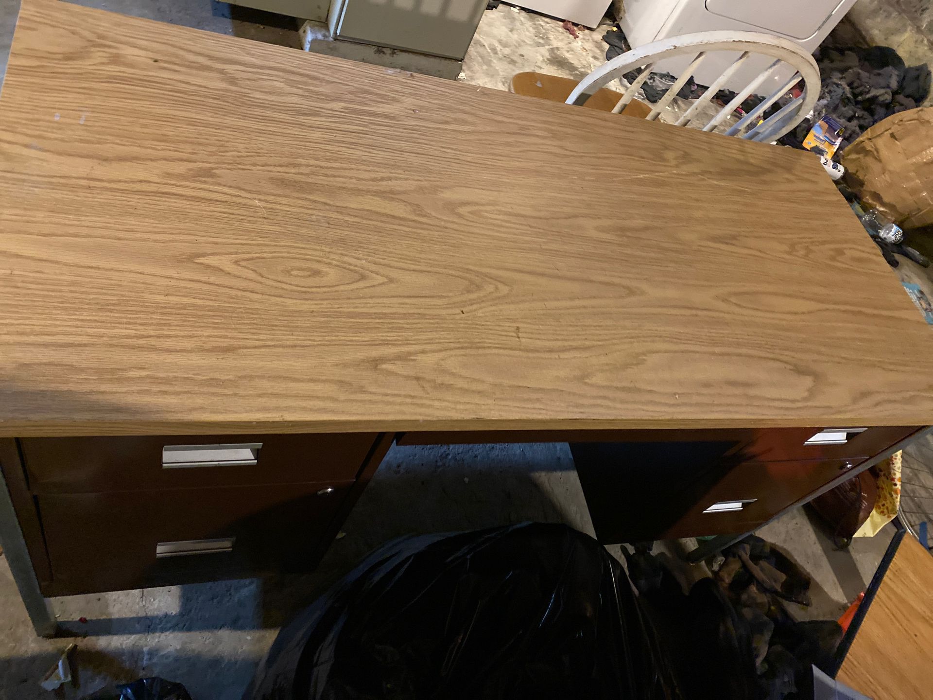 Wooden desk with a lockable metal cabinent.