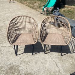 Antique Wicker Chairs Made Out Of Metal On The Bottom