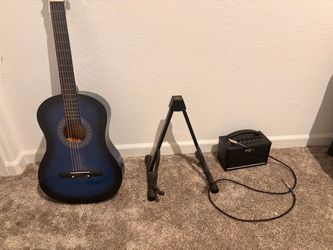 One guitar electric guitar stand with a boss amp