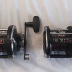 2 Penn 330 GTI Graphite Fishing Reels. Both In Good Condition.