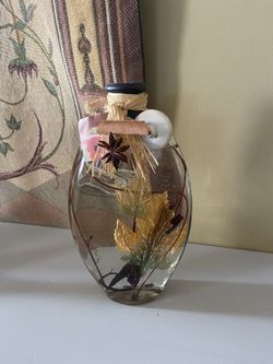 Heavy Glass Oil Lamp Bottle Filled With Decorative Leaves And Sticks