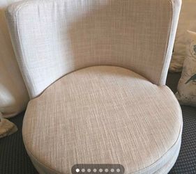 Set of two wooden swivel chairs.