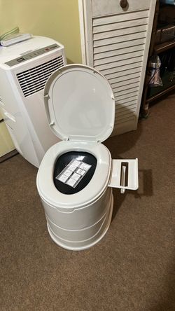 Portable toilet, never used.