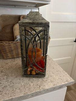 Metal lantern with fall candle, and flowers $15