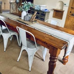 Farmhouse Table With Distressed Modern Metal Chairs