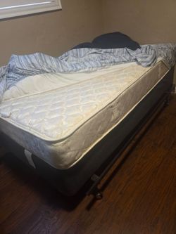 Twin bed two mattresses and a bed frame all in one for only $70