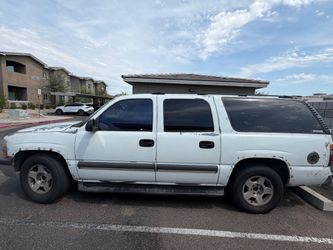 2003 Chevy Subburban (White).