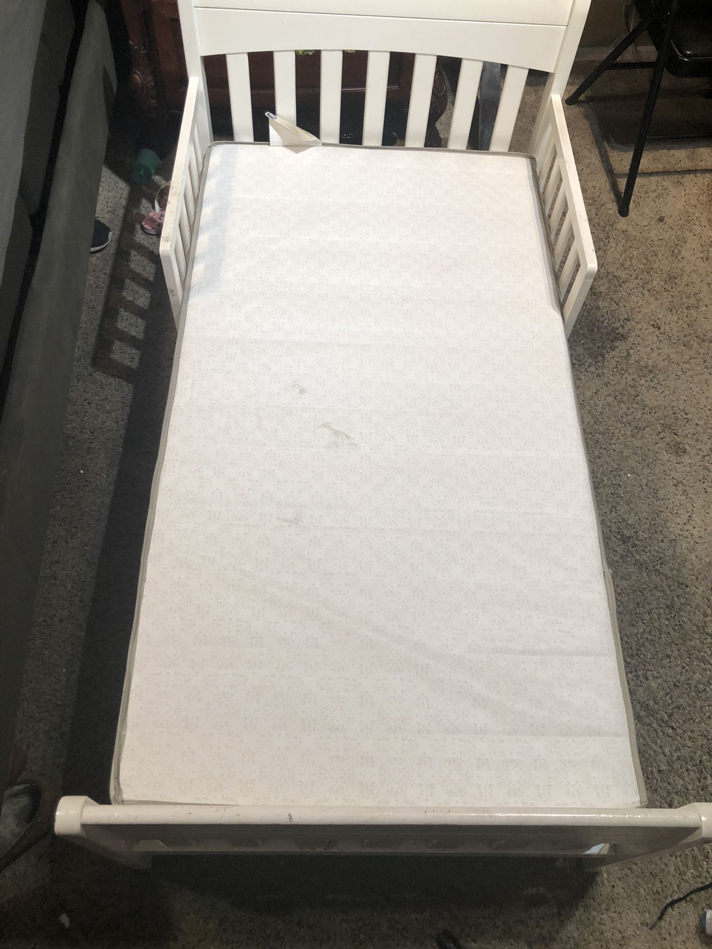 Toddler bed with mattress.