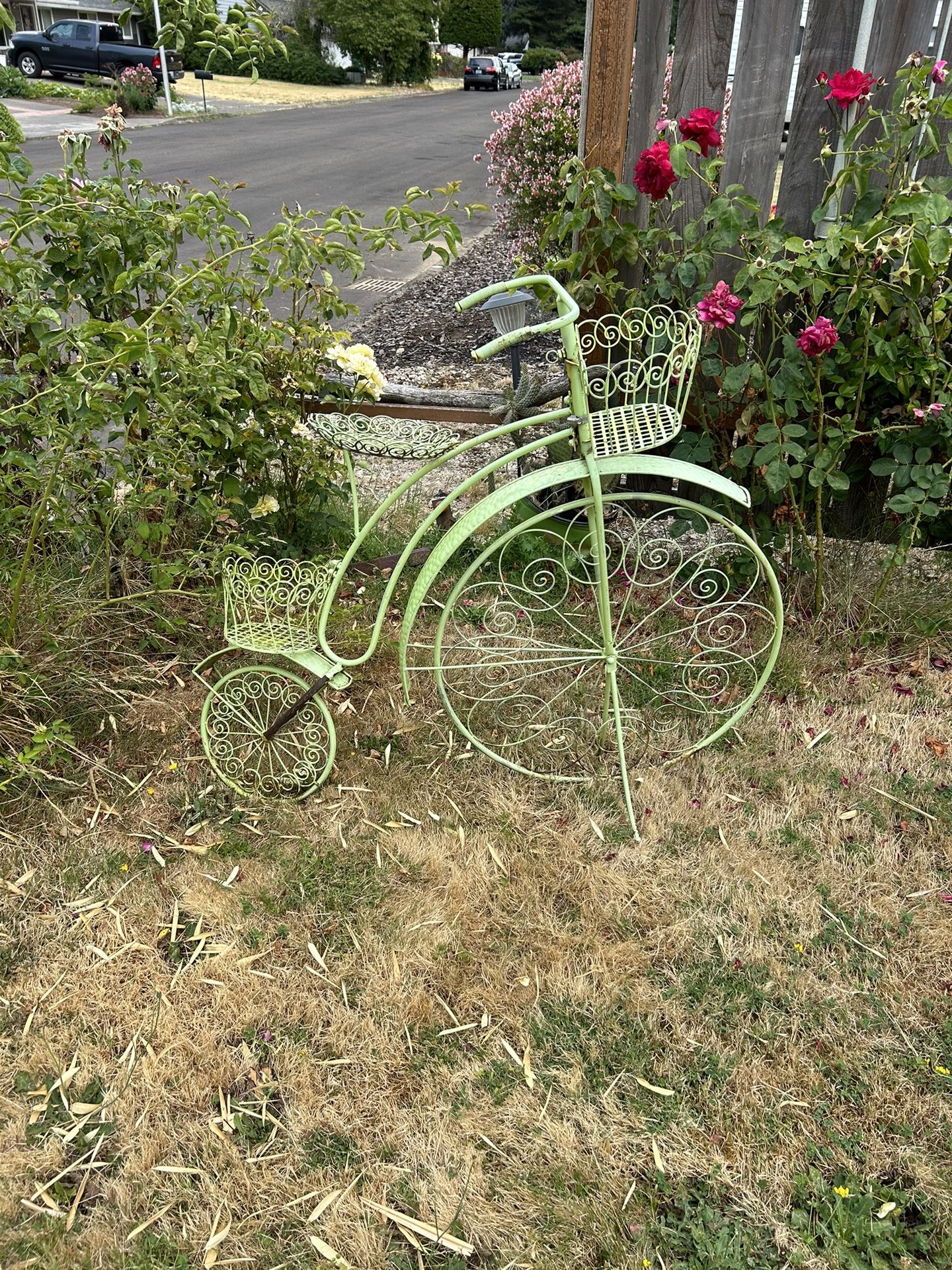 Antique green bicycle plant holder in decent shape. Holds plants in three different areas. Very unique. Cool green color could probably use some touc