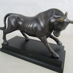 Wall Street Vintage Bronze Tone Brass Bull Statue 13 3/4" Length


The Bull is 13 3/4" length X 8 3/4" height X 5 1/2" base width, and the horn width 