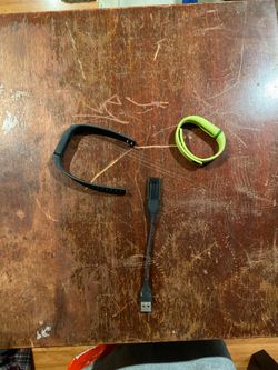 Original Fitbit, charger, and two bands