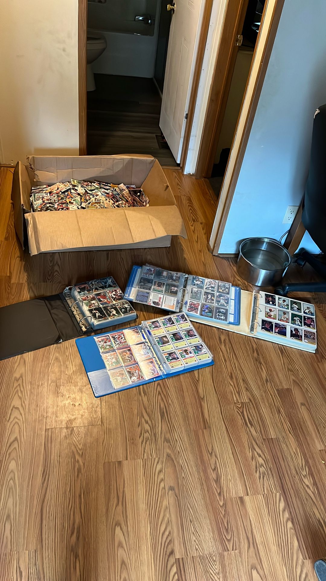 Big box of baseball basketball and football cards, and four books full of baseball basketball and football cards