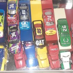 Hot Wheels Nascar Indy Championship series 23 Cars and Trucks With Metal Trailers.