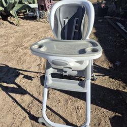 Ingenuity SmartClean Trio Elite 3-in-1 convertible high chair in slate gray. 