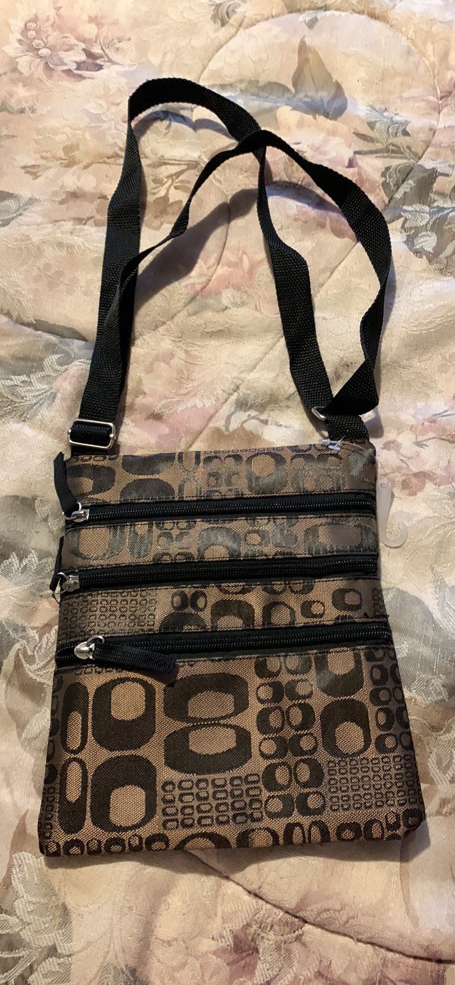 Brand new Crossbody type purse, 9 inches tall by 8 inches wide