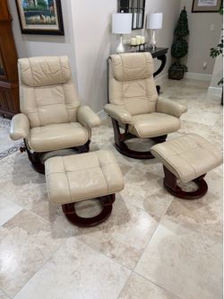 2- leather swivel recliners with ottoman.