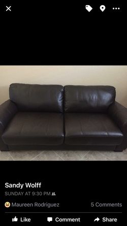 Leather sleeper couch excellent condition. Full size memory mattress.