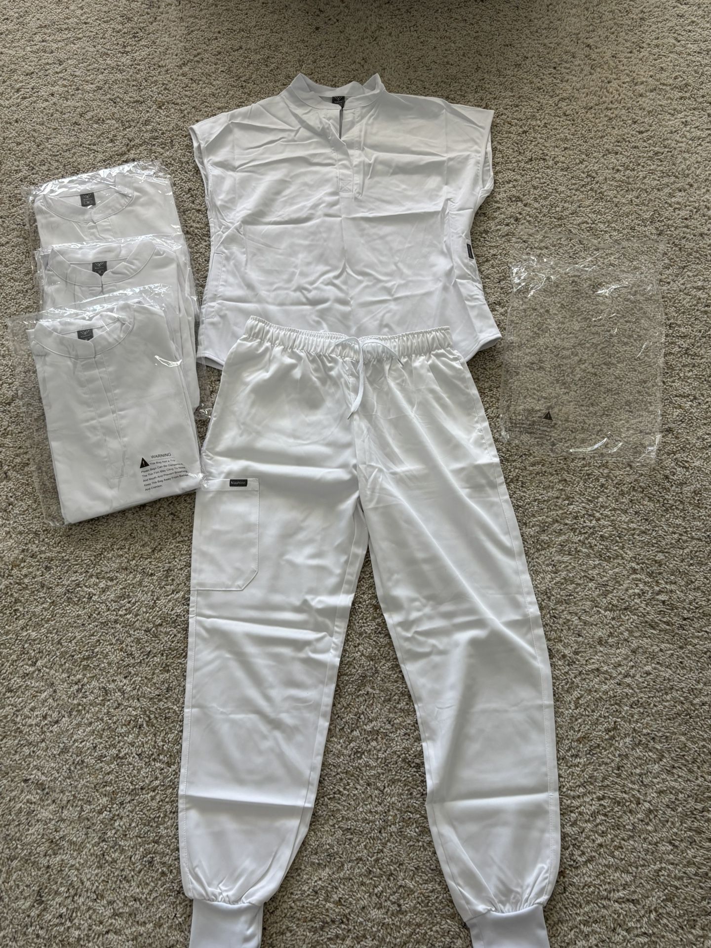 White Scrub Set – NiaaHinn (Top + Jogger Pants) – Size M - $25 Each Set (4 Total)
