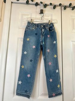 Gap jeans with stars and frayed bottoms, size 12
