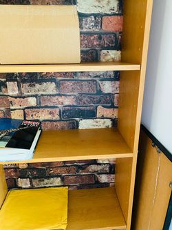 Bookcase/Shelf Unit. Very capacious. Excellent condition. Great bargain. Olden bricks pattern background. 71.25” tall. 24.75 x 9.75”. Storage organize