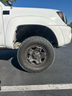 265 70 r16 wild peak tires and Tacoma rim