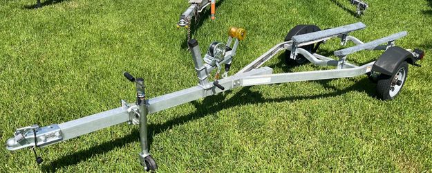 Aluminum Jet ski trailer like new . Registration.