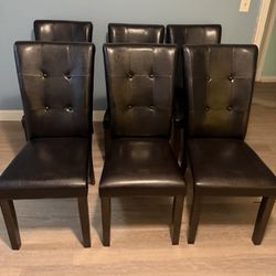 8 dining room chairs dark brown(looks black)