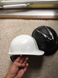2 hard hats, 1 new/ 1 used