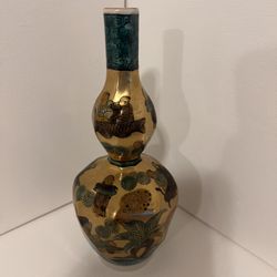 an antique Japanese vase hand-painted in gold